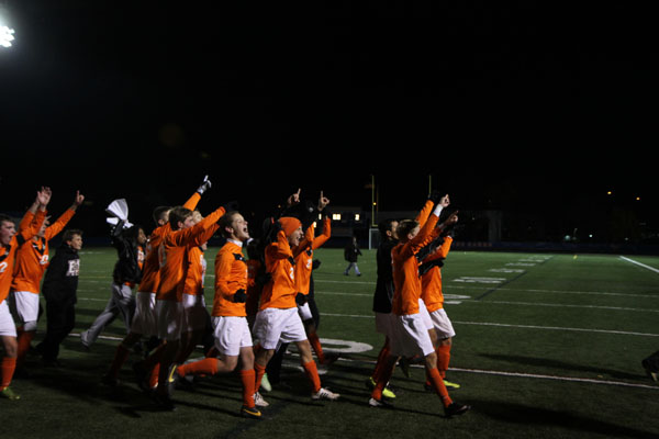 The team greets their fans in the stands after claiming the 2013 class 3A state title Saturday.