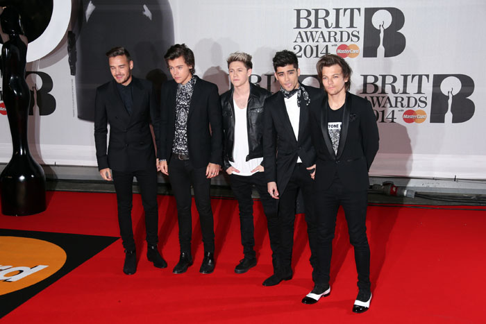 One Direction poses for pictures at the 2014 Brit Awards.