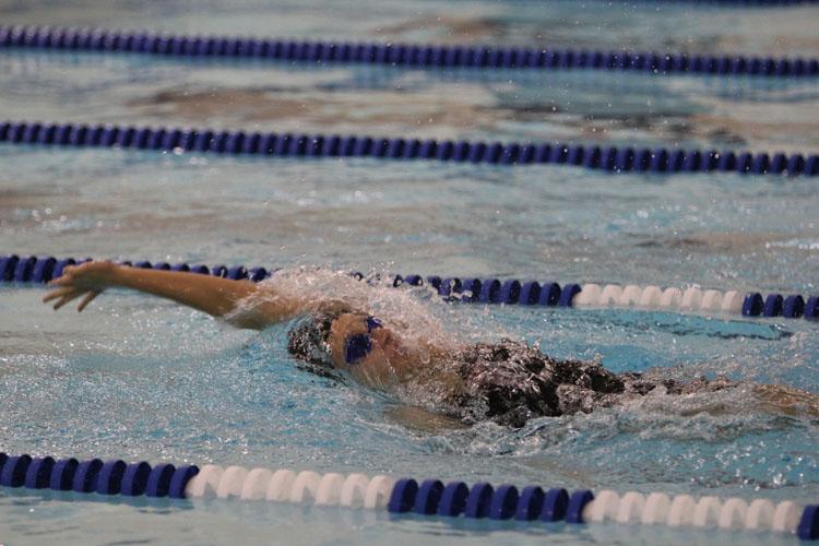 Bailey Grinter races her specialty stroke of backstroke. 