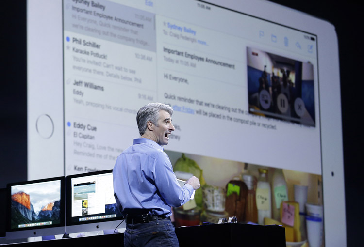 FILE - In this June 8, 2015,  file photo, Craig Federighi, Apple senior vice president of Software Engineering, demonstrates the multitask feature on an iPad at the Apple Worldwide Developers Conference in San Francisco. With the upcoming iOS 9 update, you can slide a window from the right of an iPad to launch a second app, such as a map when you’re doing email. (AP Photo/Jeff Chiu, File)