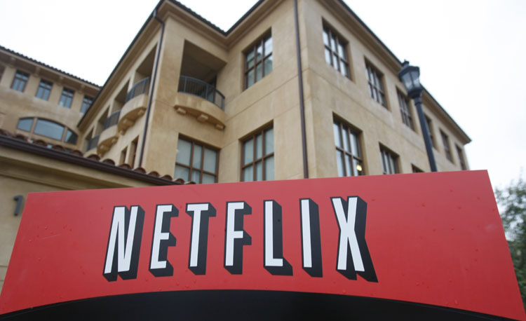 FILE - This Jan. 29, 2010, file photo, shows the company logo and view of Netflix headquarters in Los Gatos, Calif. Netflix reports quarterly earnings on Monday, Oct. 21, 2013. (AP Photo/Marcio Jose Sanchez, File)