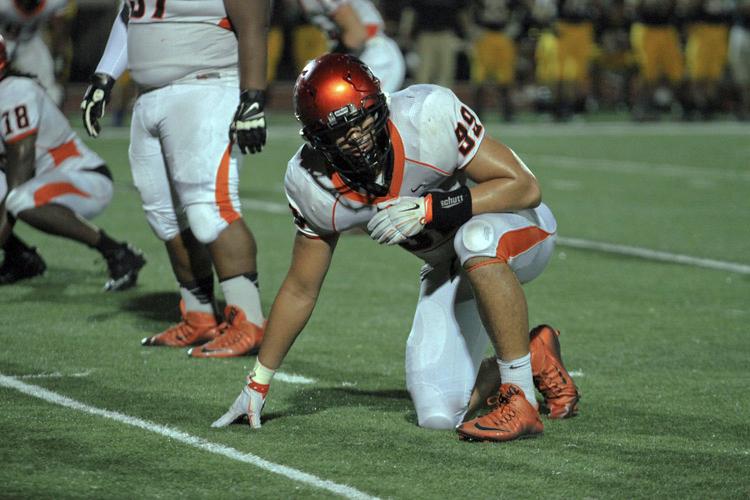 Iowa commit AJ Epenesa lines up before the snap against OFallon. 