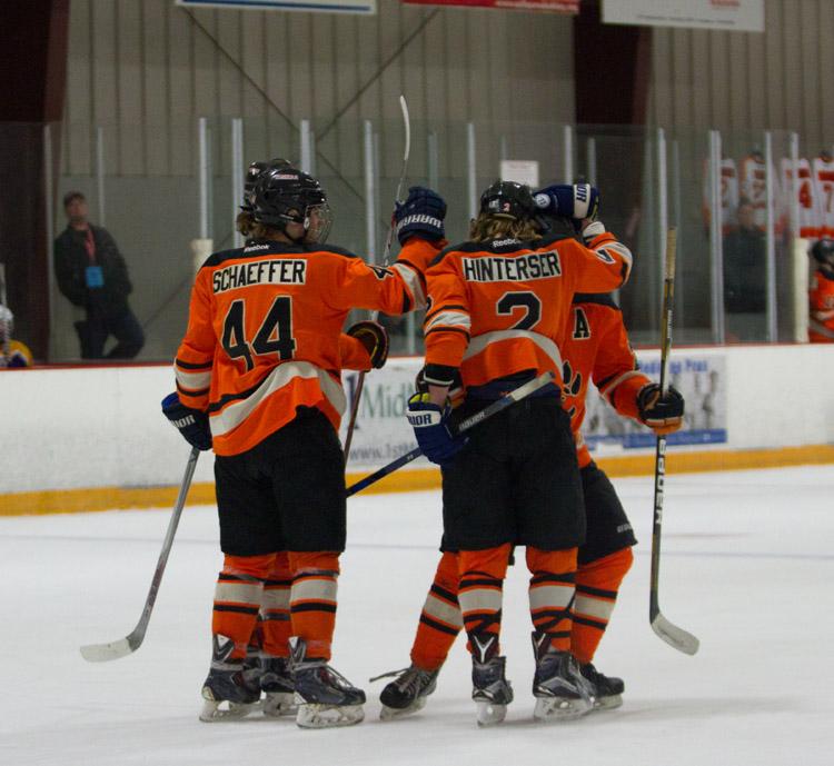 The team celebrates a goal against Bethalto on Jan. 4 on senior night. 