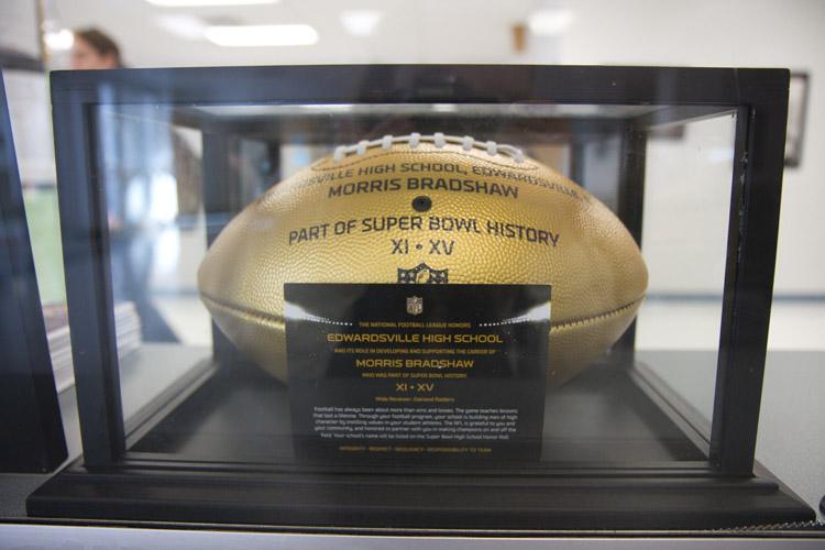 EHSs Golden Football is displayed in the front office along with a picture of Bradshaw. 