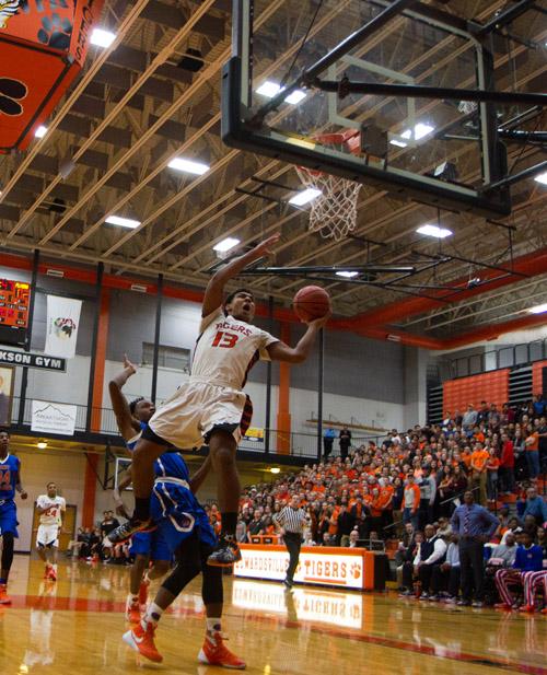 Mark Smith goes up for a basket in the first quarter against East St. Louis. The Tigers went on to win 63-54.