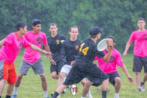 Matt Nuoffer and Gavin Menk toughen through the  rain to get open for Carl Eastman's throw.