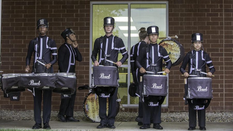 Marching band's percussion plays during the Tiger Prowl.