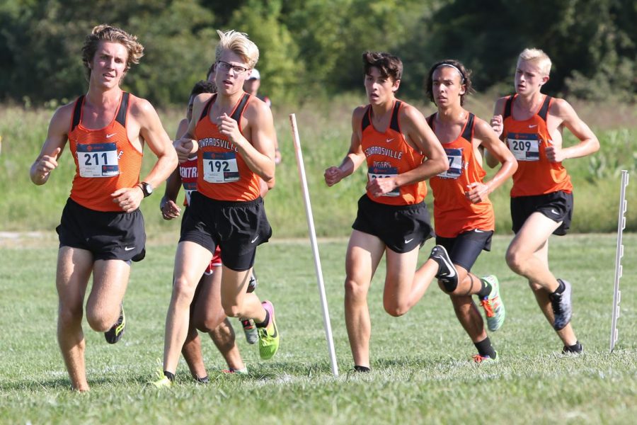 Senior Roland Prenzler, juniors Henry Gruben, Alexander Valdez, Jack Pifer and freshman Wyatt Erber lead the race around a corner at the SIUE cross-country course.