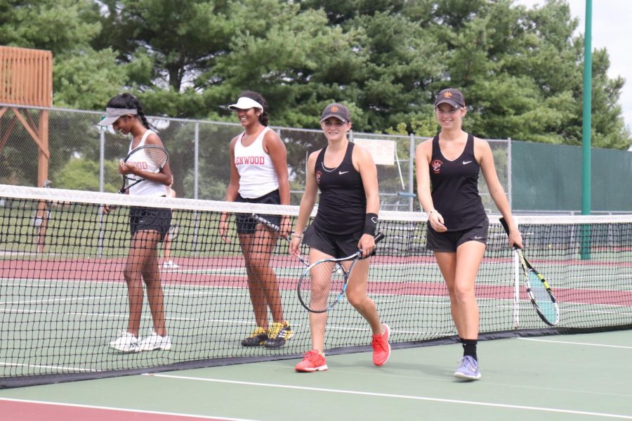 Seniors Abby Cimarolli and Annie McGinnis walk off the court after a game.