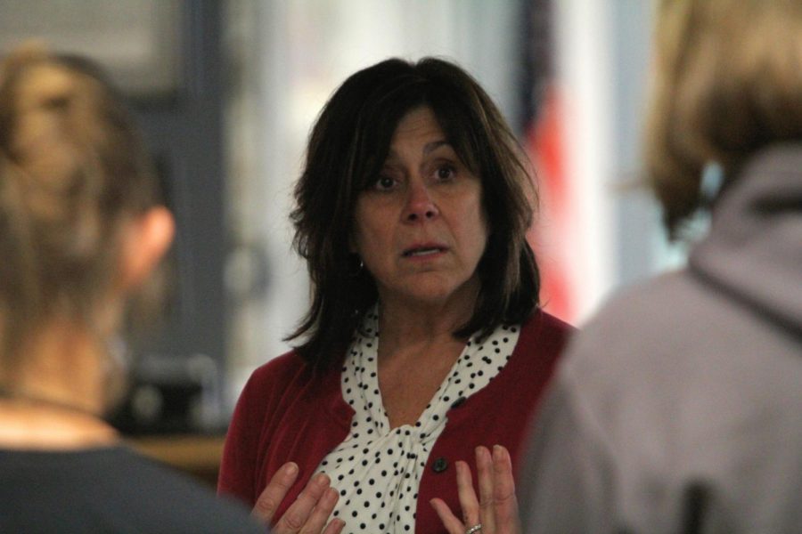 Mrs. Converse speaks with a group of teachers at Mondays award reception.