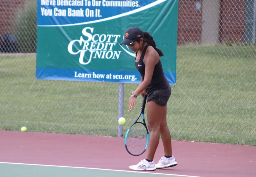 Sophomore Chloe Trimpe prepares to serve the ball in a home match.