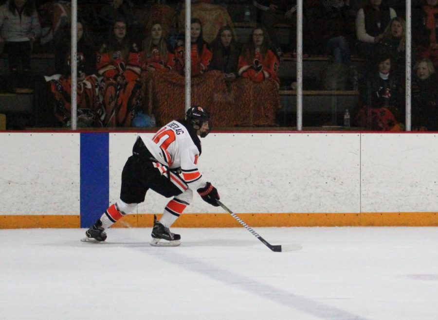 Senior captain Mitchell Oberlag skates across the rink.
