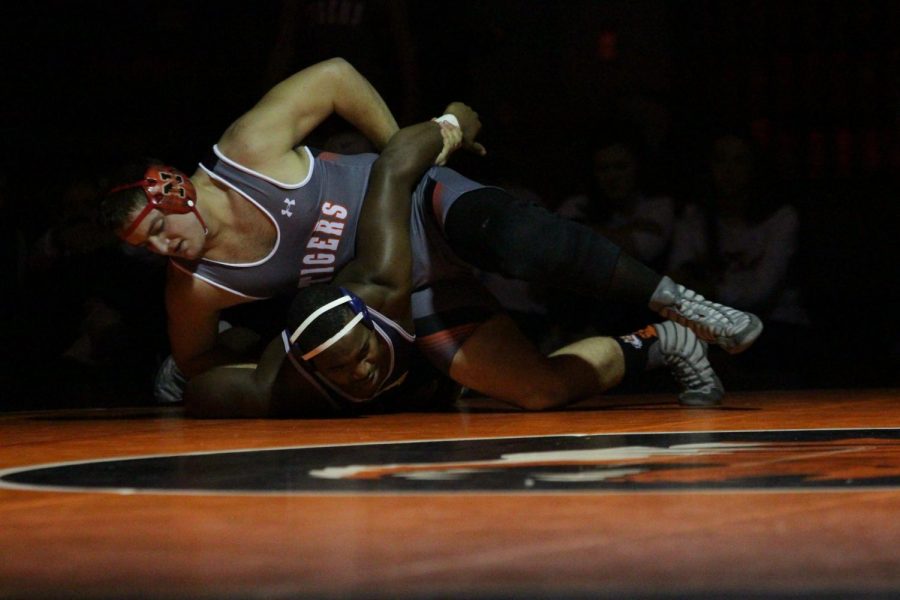 Senior Joshua Anderson pins an opponent from O'Fallon High School.