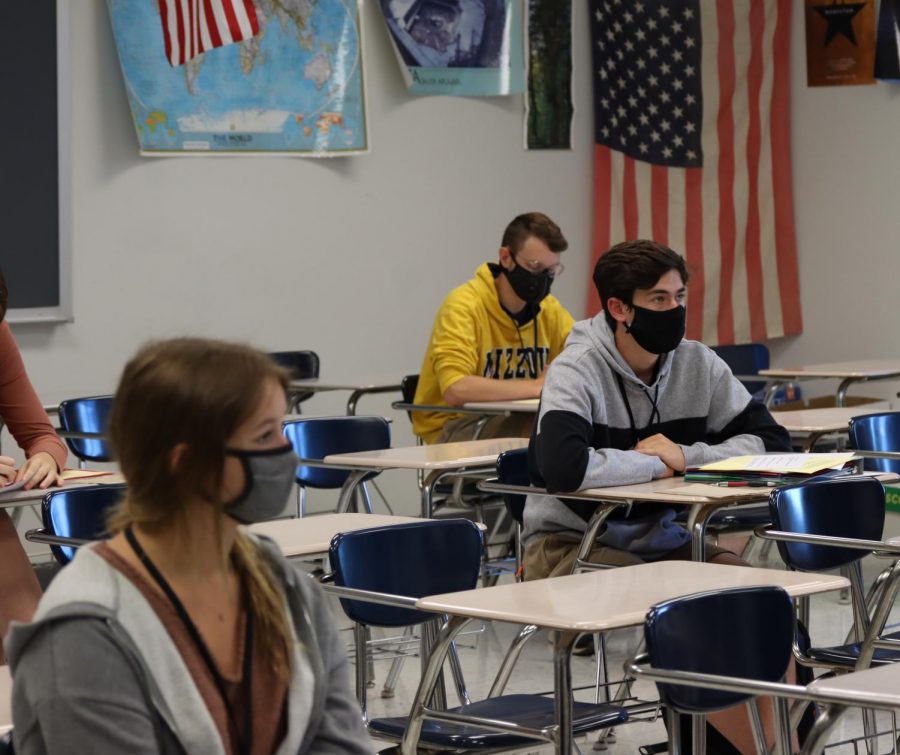 B-day students in a social studies class wait for instructions from their teacher. Approximately half of the student body attends classes in a given day.