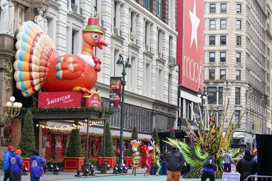 The Macys Thanksgiving Day Parade took place despite COVID restrictions. Performers wore masks and no crowds were present to limit the spread.