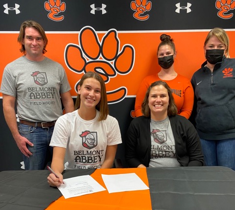 Senior Gabbi Trauernicht commits to play field hockey at Belmont Abbey with her parents and coaches at her side. 