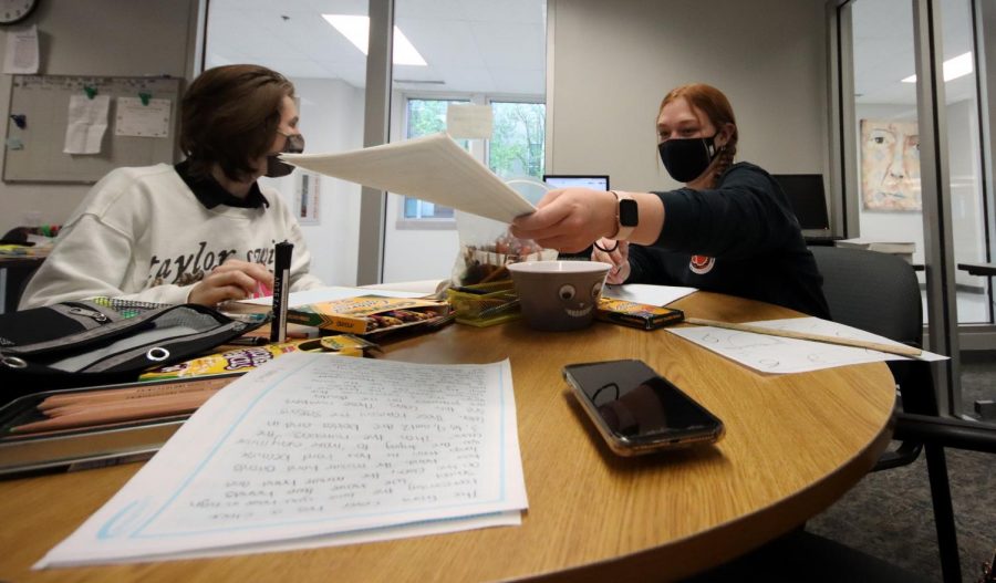 Sophomore Maddox Karnes and senior Grace Skiff work through their plan for the Yearbook Theme Development category. The duo had three hours to brainstorm a theme and both its verbal and visual components. The pair won first place.