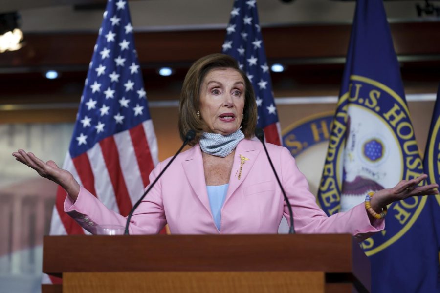 Nancy Pelosi addresses a crowd during a press conference.