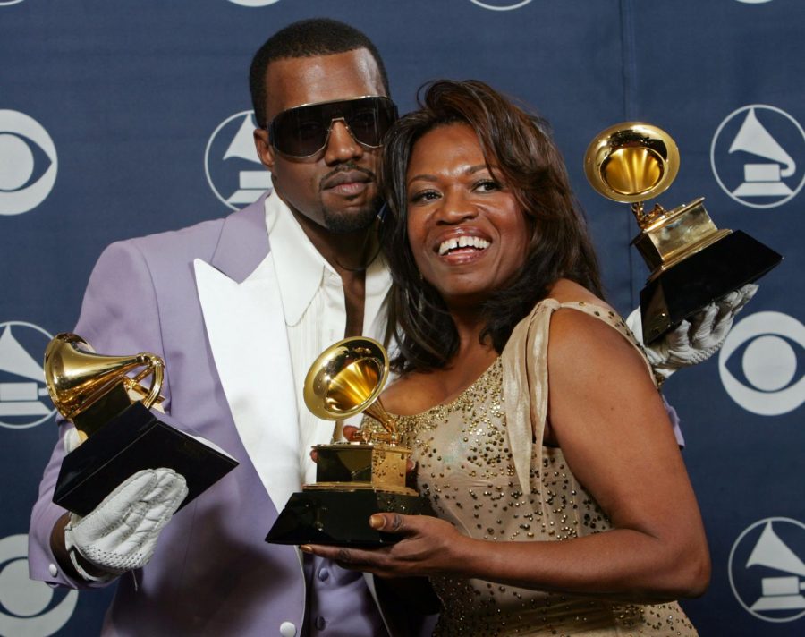 On Feb. 8, 2006, Kanye West and his late mother Donda West hold his three awards backstage at the 48th Annual Grammy Awards in Los Angeles.