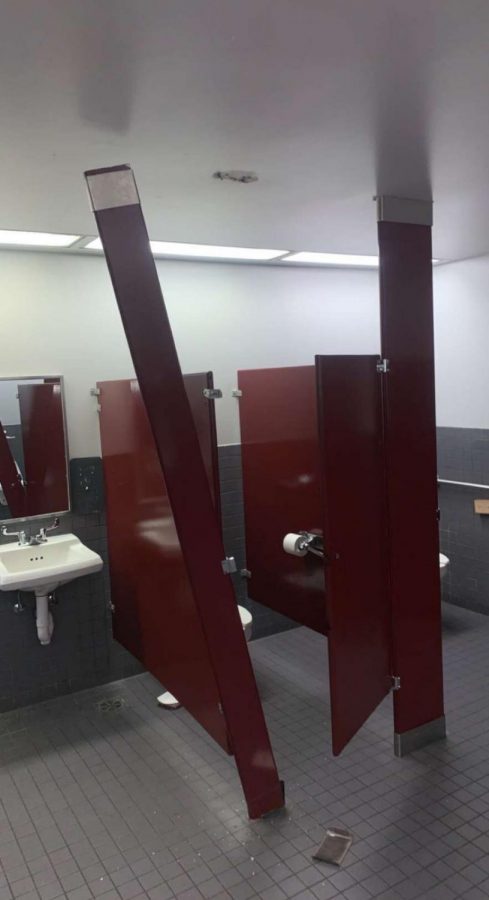A+stall+in+the+main+lobby+bathroom+is+broken+after+one+of+the+acts+of+vandalism.+The+stall+has+since+been+fixed.+Though+multiple+boys+restrooms+were+closed+down%2C+there+was+always+one+open+on+each+floor.++