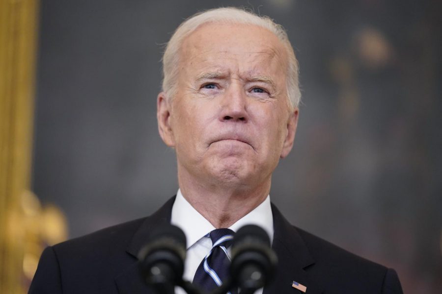 President Joe Biden addresses a crowd at a press conference.