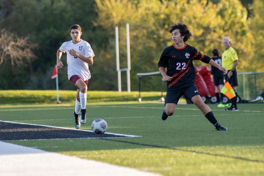 Junior Abe Gianaris defends against a Belleville West player at their Oct. 20 game.