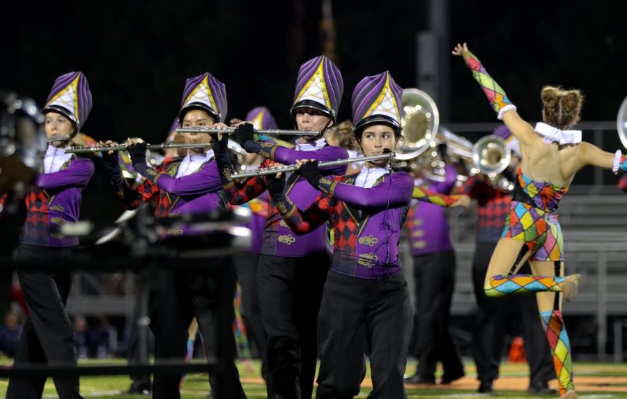 Sammi Haar, Amber Smith and Katelyn Smith perform with the EHS marching band on Aug. 18.