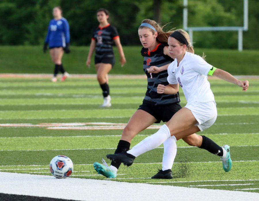 Now-senior Jadyn Renth battles for the ball during a game against Collinsville last season.