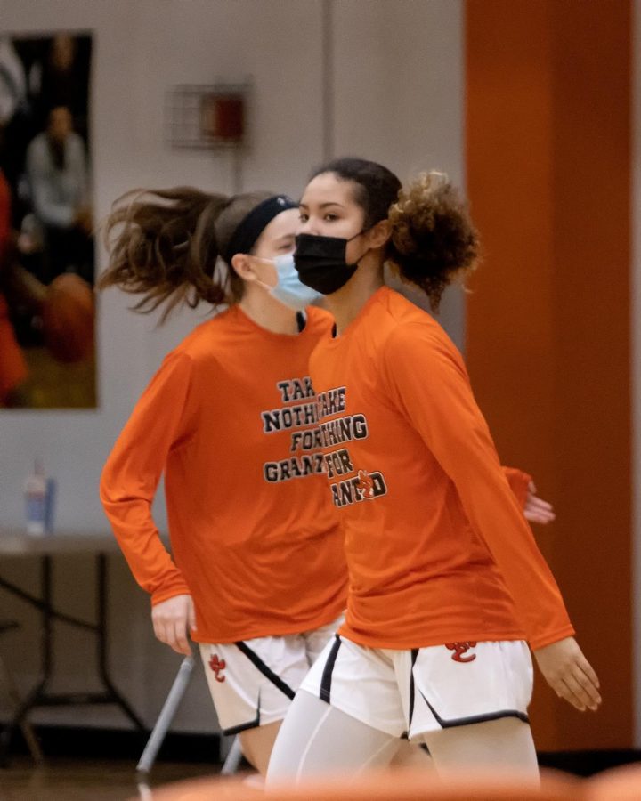 Now-senior Sydney Harris warms up before a game against Belleville West  in February.