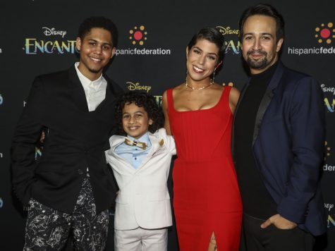 From right to left, Lin-Manuel Miranda, Jessica Darrow, Ravi Cabot-Conyers and Rhenzy Feliz stand together at the premiere of Encanto.