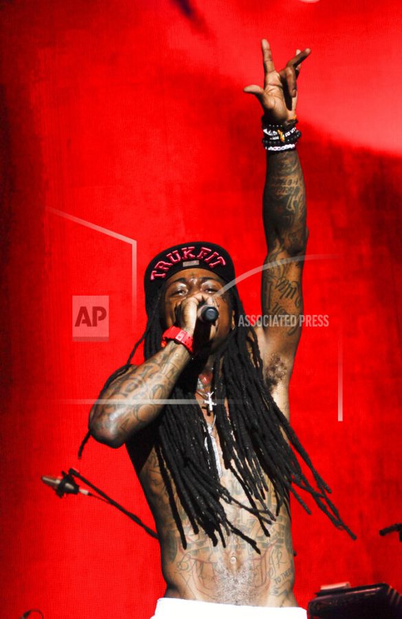 In this March 15, 2012 image, Lil Wayne performs during the SXSW Music Festival in Austin, Texas.(AP Photo/Jack Plunkett)