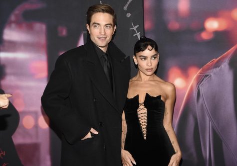 Robert Pattinson, who plays Batman, and Zoe Kravitz, who plays Catwoman, walk the red carpet at the world premiere of The Batman on March 1, 2022, in New York. 