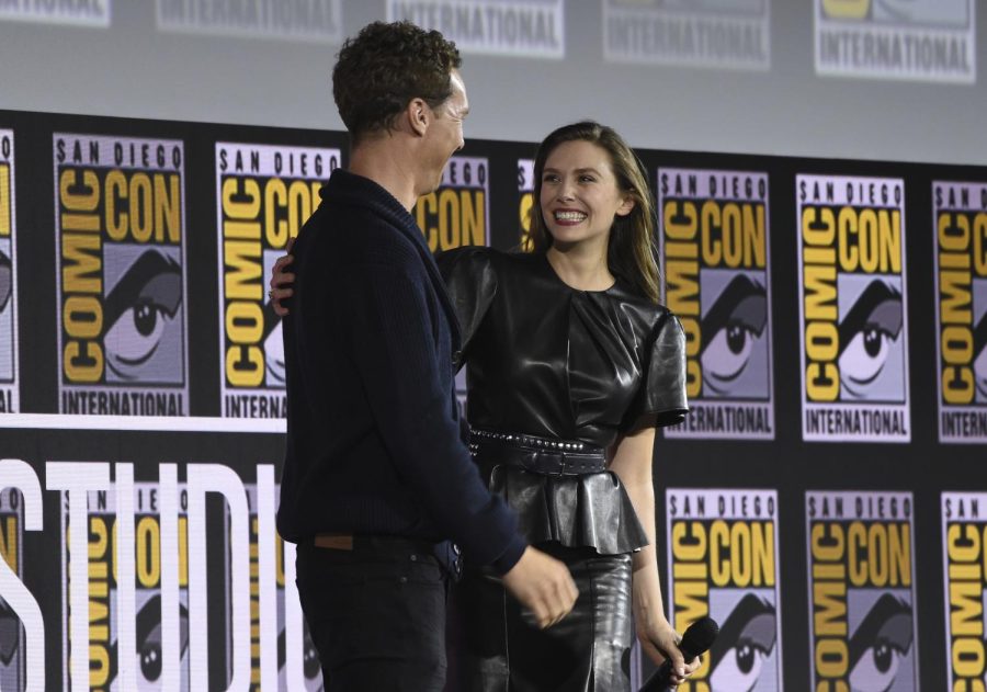 Benedict Cumberbatch, who plays Dr. Strange, and Elizabeth Olsen, who plays Wanda Maximoff, laugh together during the Dr. Strange in the Multiverse of Madness segment of Comic-Con on July, 20, 2019. 