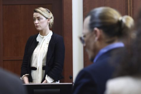 Actor Amber Heard, left, and actor Johnny Depp appear in the courtroom at the Fairfax County Circuit Court in Fairfax, Va., Thursday, May 5, 2022. Depp sued his ex-wife Heard for libel in Fairfax County Circuit Court after she wrote an op-ed piece in The Washington Post in 2018 referring to herself as a public figure representing domestic abuse.