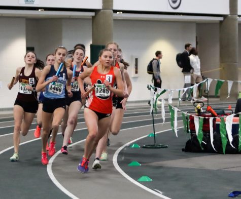 Junior Riley Knoyle leads the pack in a relay during the indoor State competition. Track and Field competes indoors during the colder months and moves outside later in the Spring.