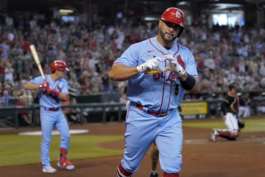 Albert Pujols shows love to the fans after hitting a home run in a 16-7 win against the Diamondbacks on August 20.