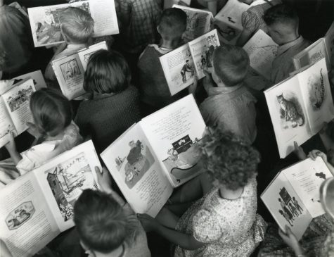 Children reading c.1960 Celebrating World Book Day by Archives New Zealand is licensed under CC BY 2.0. To view a copy of this license, visit https://creativecommons.org/licenses/by/2.0/?ref=openverse.