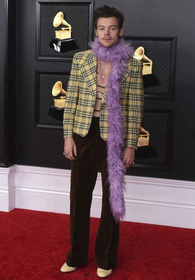 Harry Styles poses in the press room at the 63rd annual Grammy Awards at the Los Angeles Convention Center on Sunday, March 14, 2021. Courtesy of AP Images.