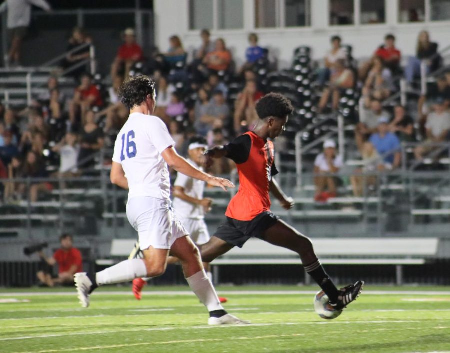 Senior Axton Anom prepares to pass the ball down the field during a Sept. 6, 2022 against Belleville East.