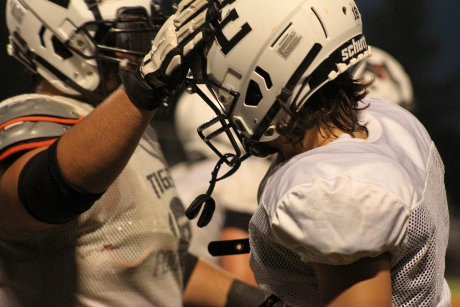 EHS football players get ready for their upcoming season at the Orange and Black Scrimmage on Aug. 19. 