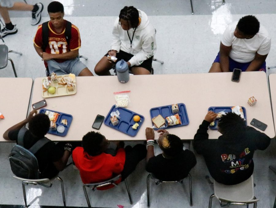 EHS students eat lunch on the first day of school, the first time lunches costed $3 in over a year.