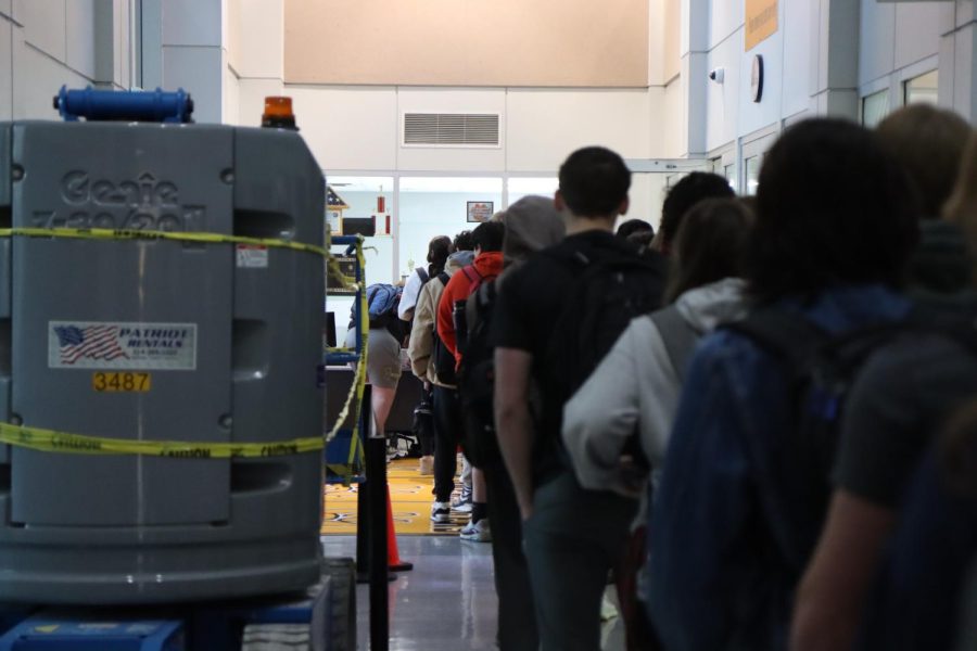 Students wait to get checked into the building on Jan. 8, 2022.