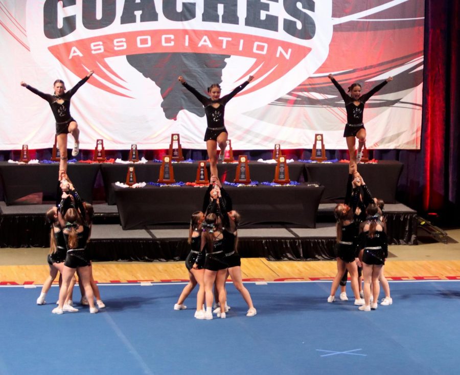 The EHS varsity cheer team receives first place at ICCA competition.