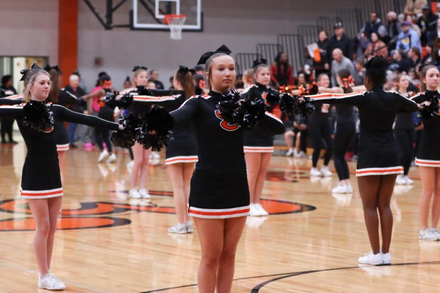 Cheerleaders preform at a basketball game against O'Fallon on Dec. 7.