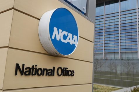 Signage at the headquarters of the NCAA is viewed in Indianapolis, March 12, 2020. Courtesy of AP Newsroom.