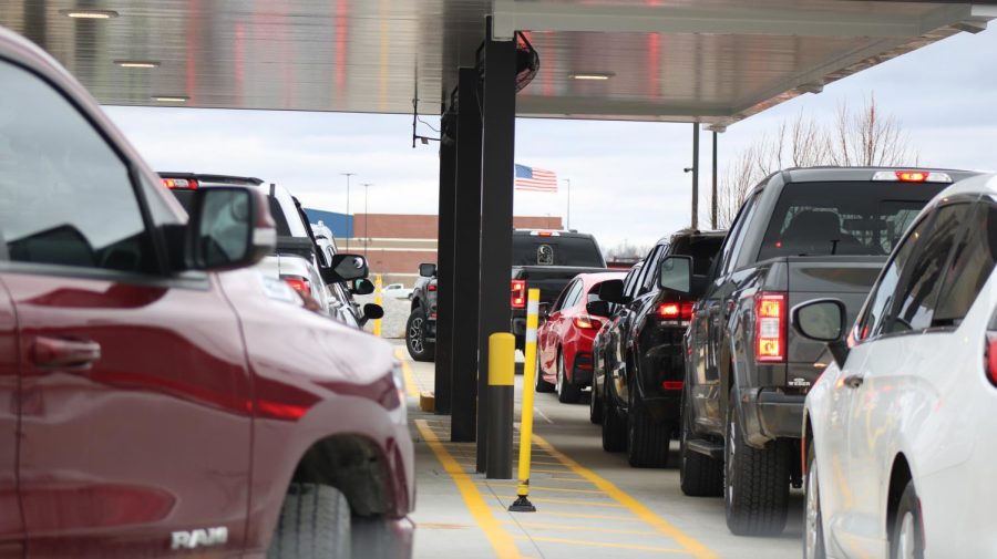 Cars wait in line to get their orders in the Chick-fil-A drive thru on Thursday, Feb. 9, the grand opening of the restaurant.