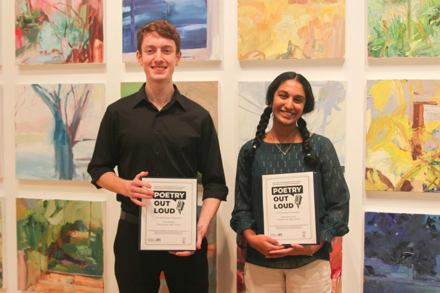 Senior Alex Walker and sophomore Veda Kommineni pose with their regional POL awards. The two will advance to the state competition on March 13.