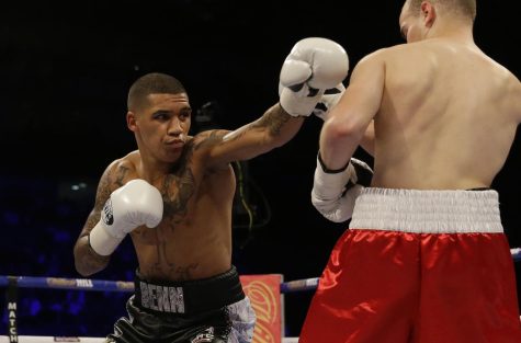 British boxer Conor Benn, left, hits Czech boxer Lukas Radic during their Super-Lightweight bout at the O2 Arena in London, June 25, 2016.