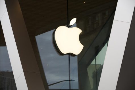 An Apple logo adorns the facade of the downtown Brooklyn Apple store on March 14, 2020, in New York. Apple is getting into the Buy Now, Pay Later space with a few tweaks to the existing model — including no option to pay with a credit card. The company will roll out the product to some consumers spring 2023, and will begin reporting the loans to credit bureaus in the fall.