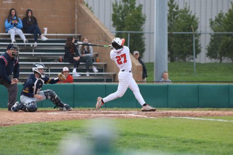 Sophomore Joseph Chiarodo hits the ball during a April 6 game against OFallon at the District 7 Sports Complex.